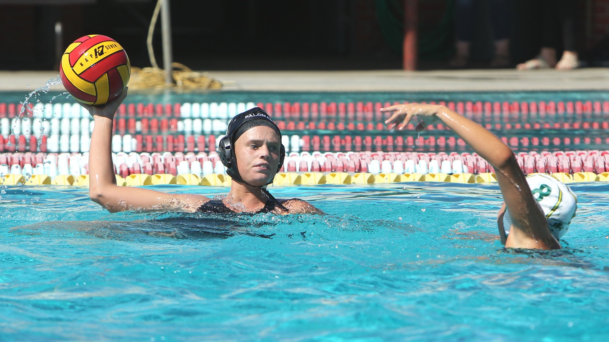 Emma Thomas gets ready to send her second goal into the net against Grossmont College on Wednesday afternoon at Wallace Memorial Pool. (Hugh Cox Photo)