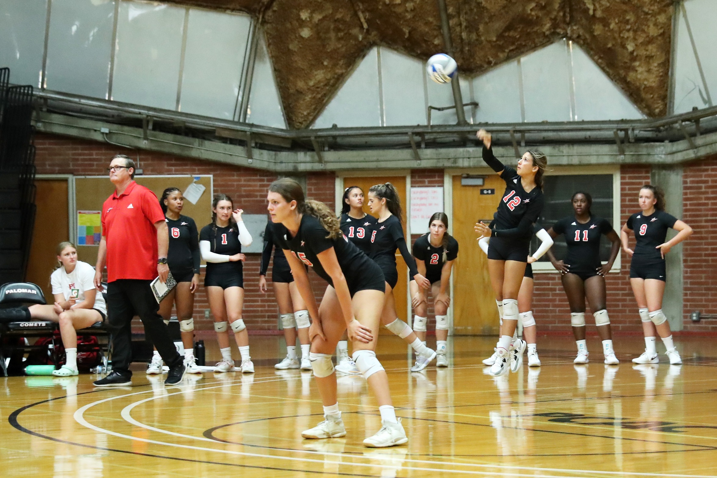 Bailey Prieto (No. 12) finished the night with three aces. Photo by Hugh Cox.