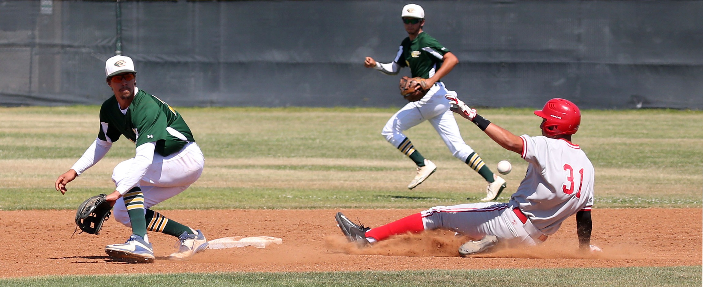 Cameron Haskell, No. 31, sliding into second base against eventual state champion Grossmont, is one of two Comets headed to the University of Arizona. -- Photo by Hugh Cox