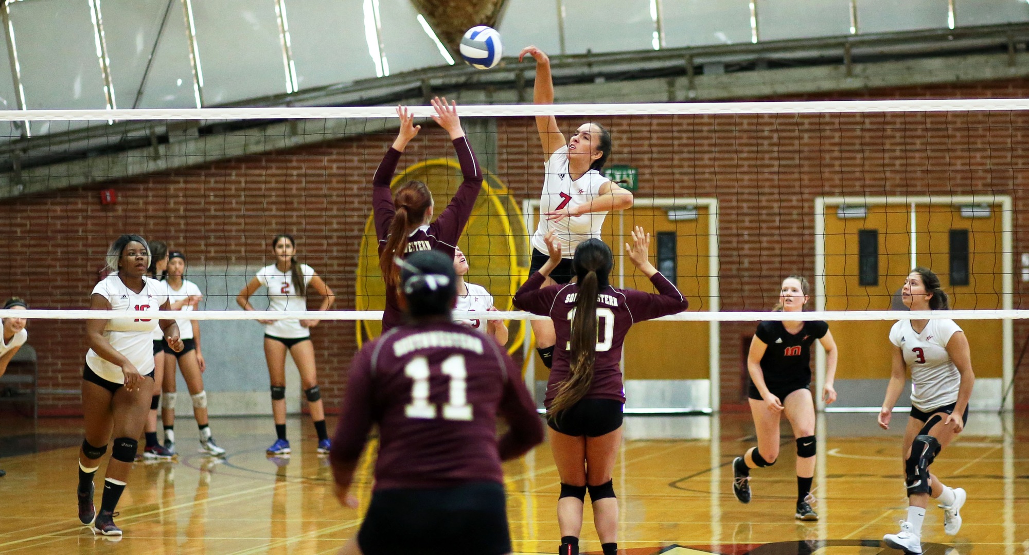 Samantha Radebaugh spikes the ball in sweep of visiting Southwestern. -- Photo by Hugh Cox