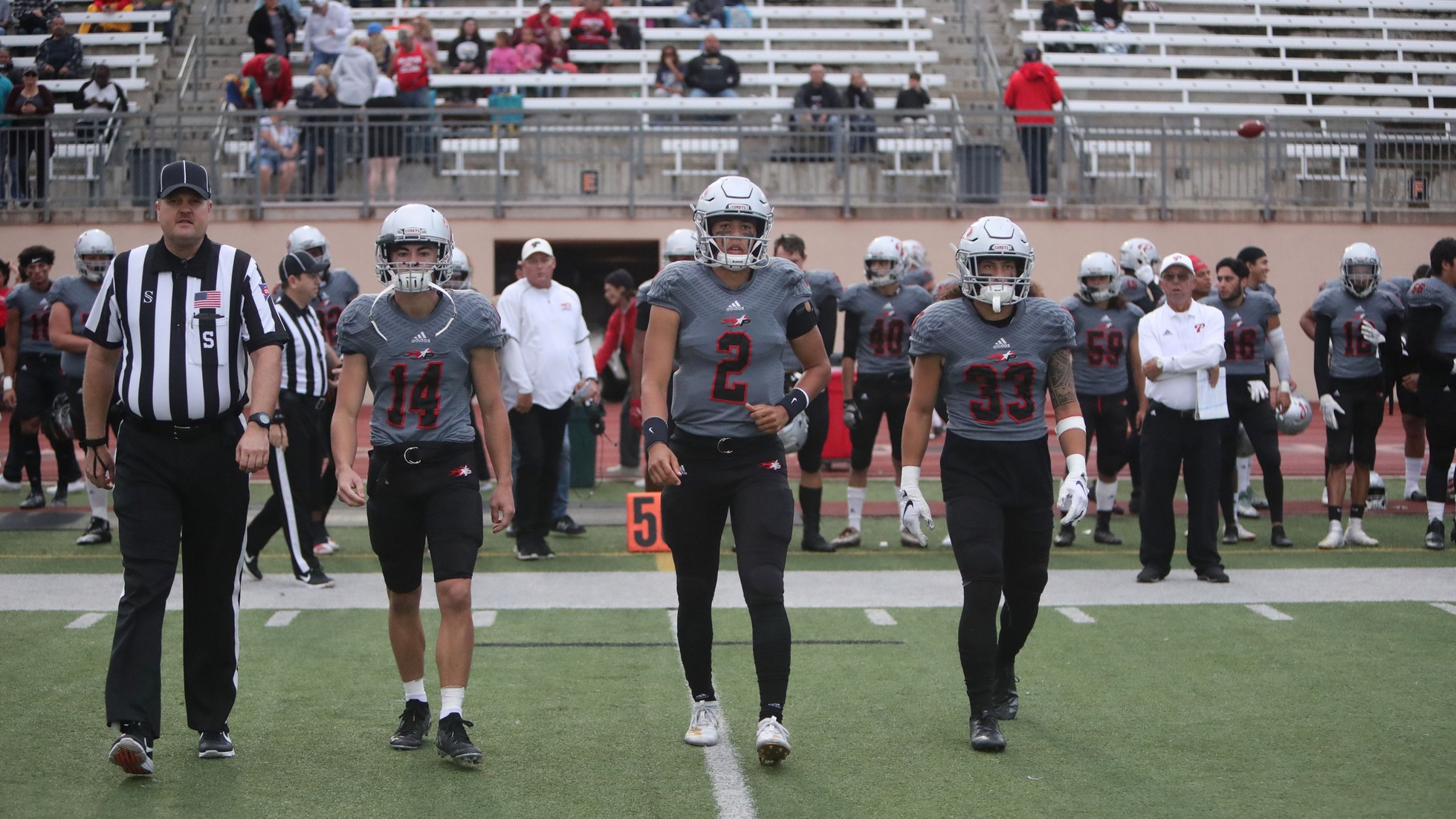 Last week's captains (Johnny Armentrout, Rodney Thompson and Giovanni Herrera) walk out for the coin toss. Photo by Hugh Cox.