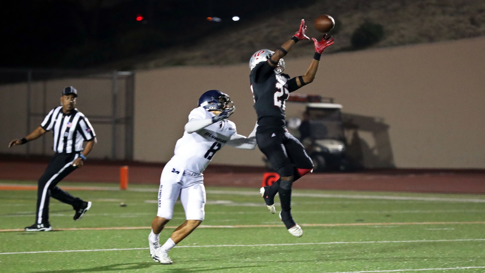 This interception by David Quintanilla with 43 seconds remaining in the first half put a stop to Mesa’s drive and insured the Comet 17-13 halftime lead. Photo by Hugh Cox.