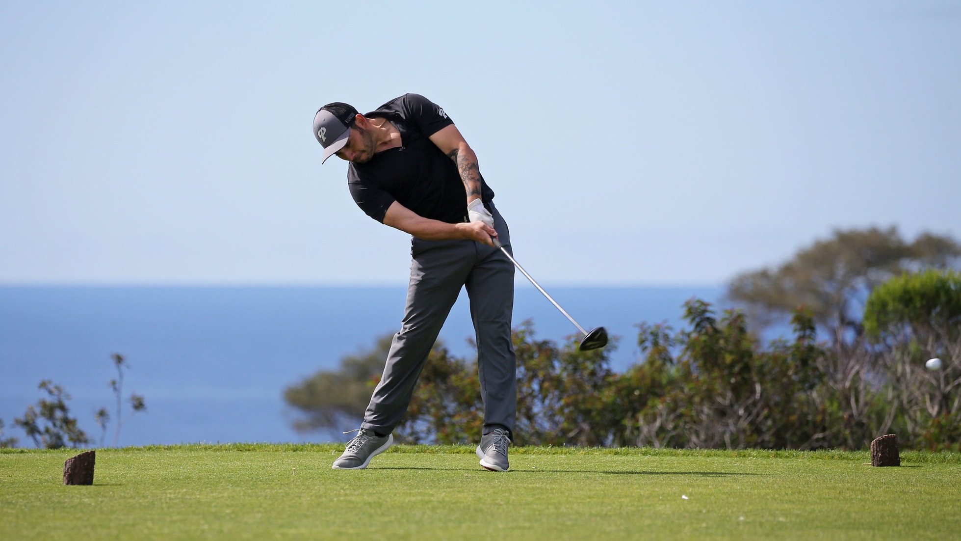 Eric Bolander tees off at Torrey Pines Golf Course. Photo by Hugh Cox.