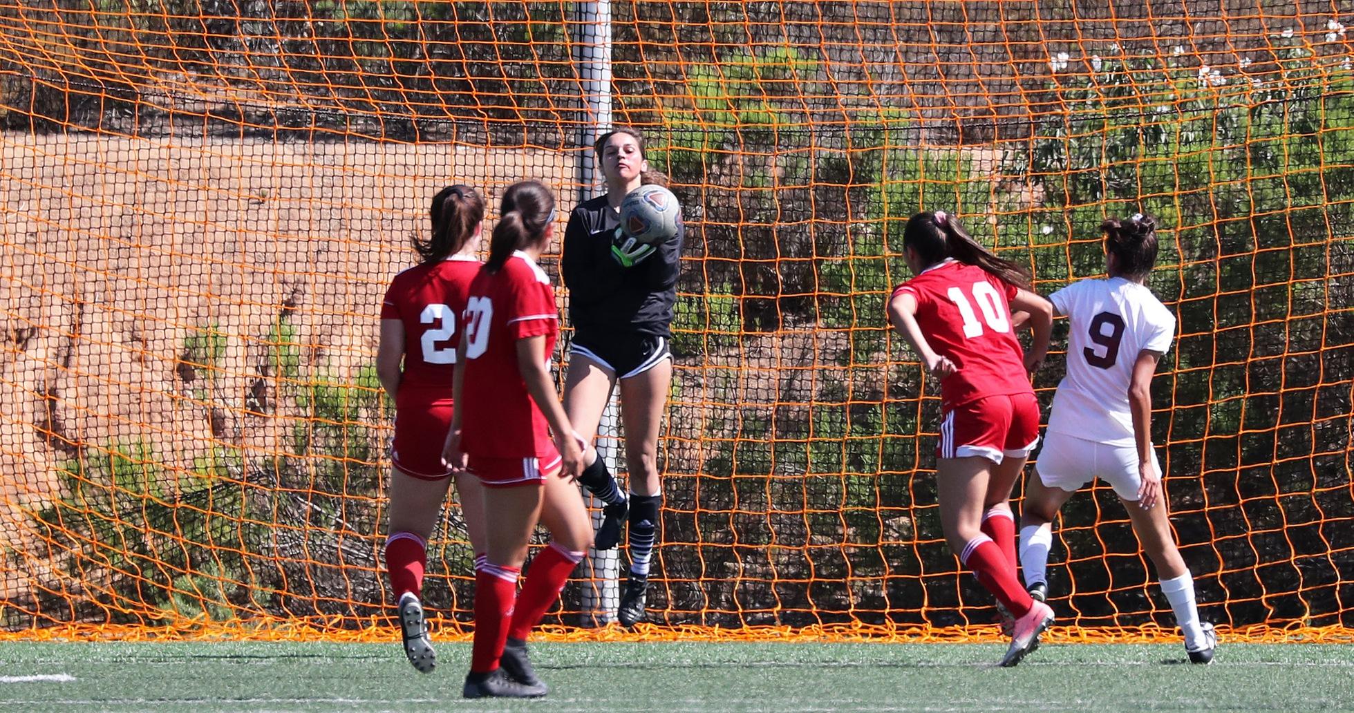 Goalie Kassandra Blanchard with a save in the first half. Photo by Hugh Cox.