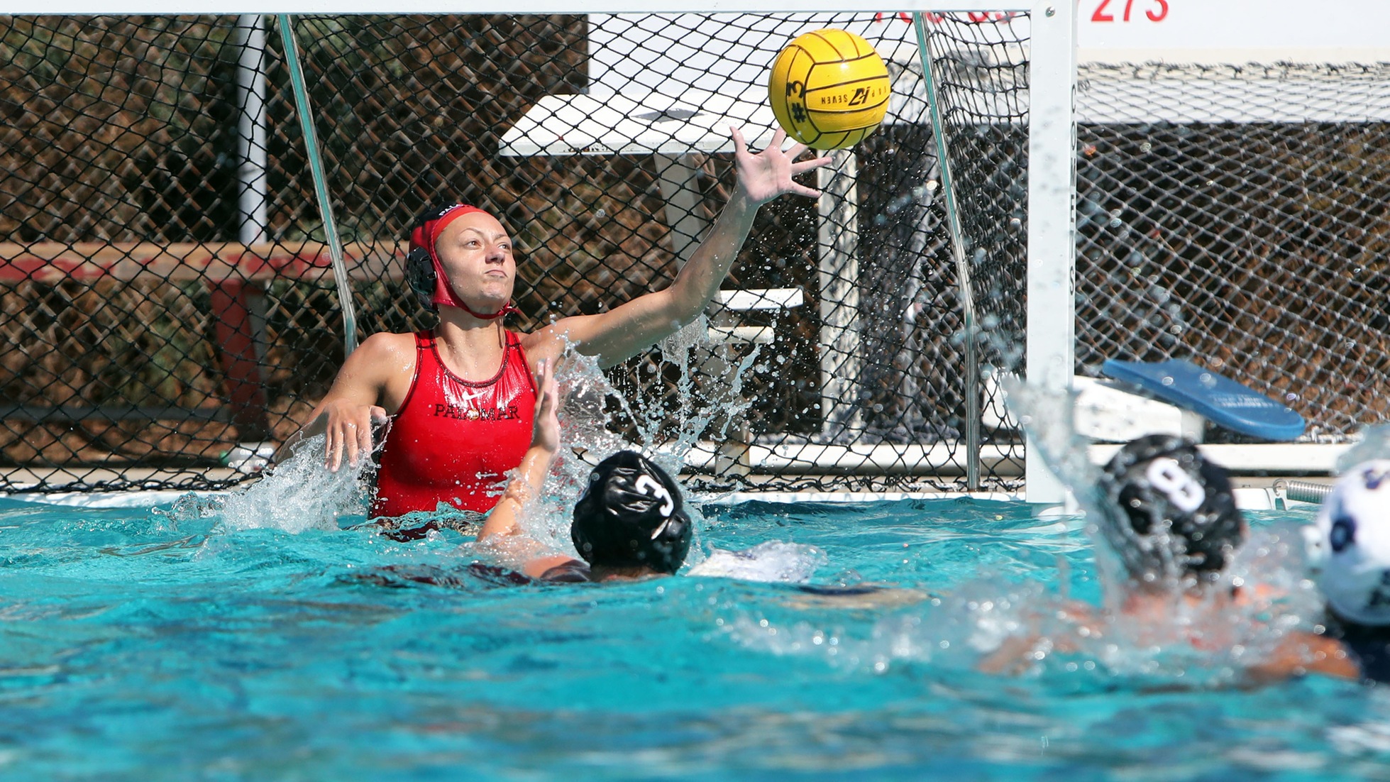 Julia Miller gets a save early in the second quarter. Photo by Hugh Cox.
