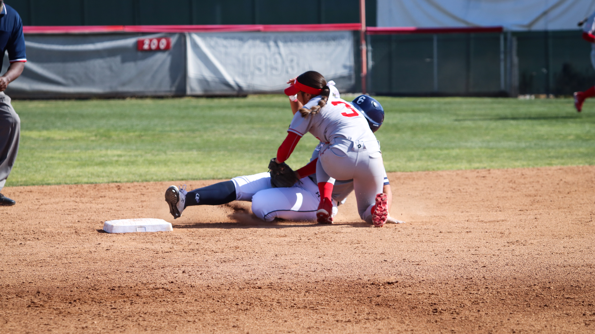 Samarah Martinez gets the runner out at second on a stolen base attempt against Cerritos College. Photo by Cara Heise.